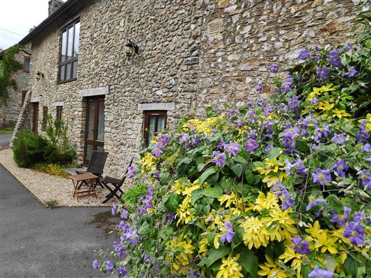 Stone facing on listed barns